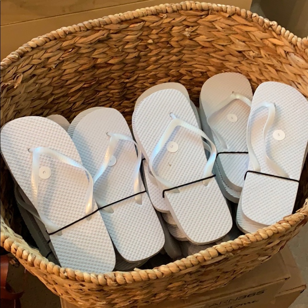 White flip flops for wedding guests.